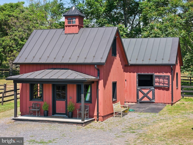 9425 Blackpond Ln, Delaplane, VA 20144 - view of front of home featuring a standing seam roof, fence, metal roof, a barn, and an outdoor structure