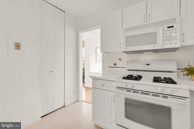 5500 Friendship Blvd Unit 2308N, Chevy Chase, MD 20815 - kitchen featuring white appliances, light countertops, white cabinets, and decorative backsplash
