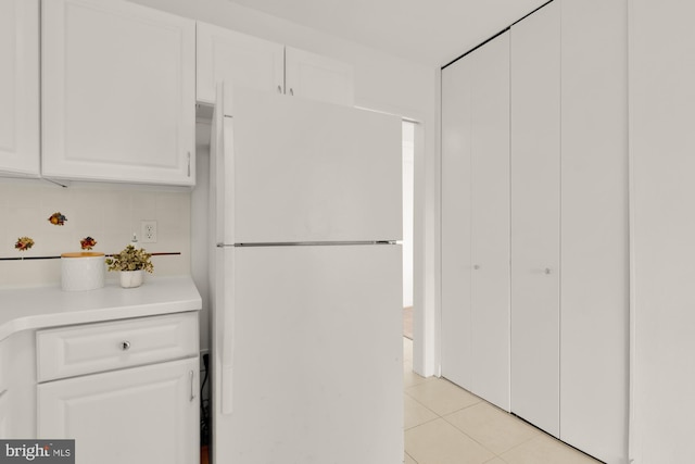 5500 Friendship Blvd Unit 2308N, Chevy Chase, MD 20815 - kitchen featuring freestanding refrigerator, light tile patterned floors, white cabinetry, and light countertops