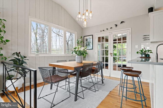 4600 Blagden Ter NW, Washington, DC 20011 - dining room with french doors, lofted ceiling, and light wood-style floors