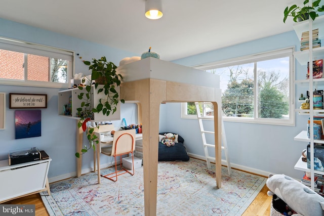 4600 Blagden Ter NW, Washington, DC 20011 - bedroom featuring multiple windows, wood finished floors, and baseboards