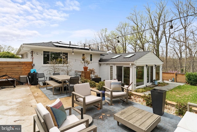 4600 Blagden Ter NW, Washington, DC 20011 - back of house with a patio area, roof mounted solar panels, outdoor dining space, and outdoor lounge area