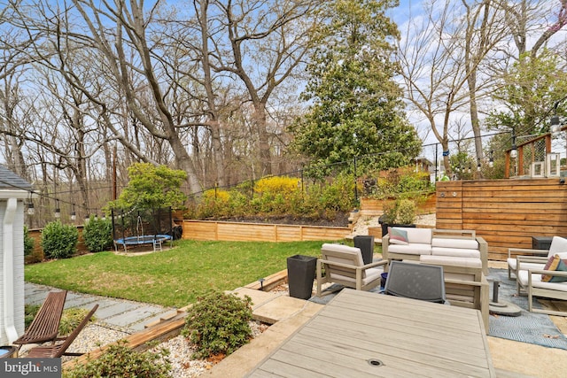 4600 Blagden Ter NW, Washington, DC 20011 - wooden deck featuring a trampoline, outdoor lounge area, and a patio area