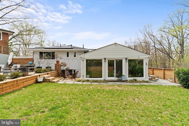 4600 Blagden Ter NW, Washington, DC 20011 - back of house featuring solar panels, a patio area, and brick siding