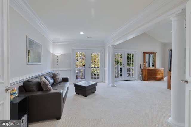 living area featuring ornate columns, french doors, ornamental molding, and carpet floors