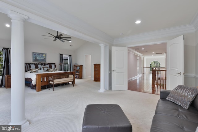living area featuring light colored carpet, ornate columns, a ceiling fan, and ornamental molding