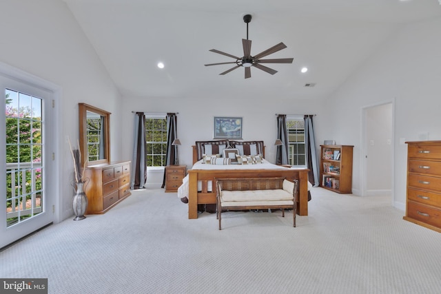 bedroom featuring recessed lighting, access to outside, light colored carpet, and multiple windows