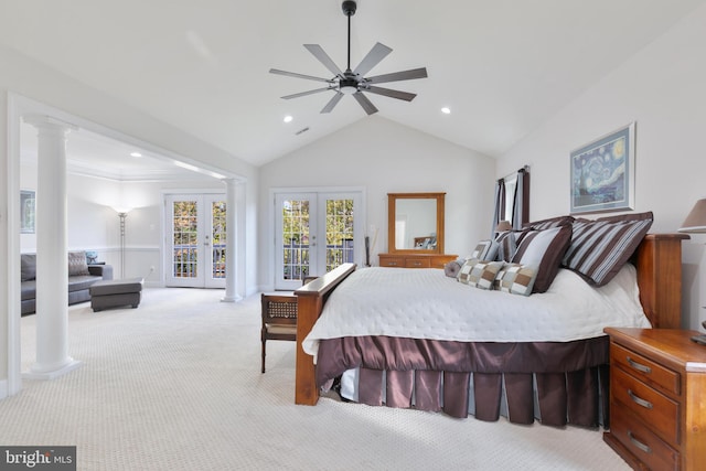 bedroom featuring access to outside, light carpet, french doors, lofted ceiling, and decorative columns