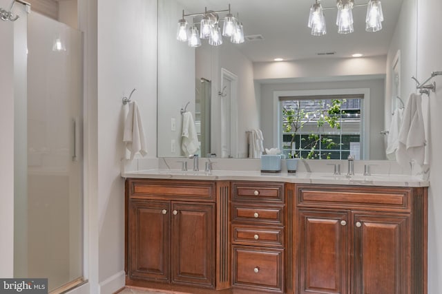 full bathroom featuring a sink, a shower, and double vanity