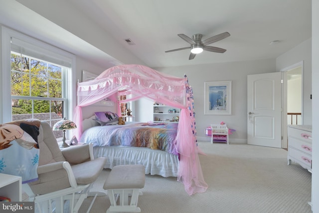 carpeted bedroom featuring visible vents and a ceiling fan