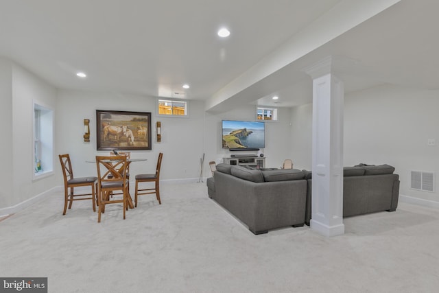 carpeted living area with visible vents, baseboards, and recessed lighting