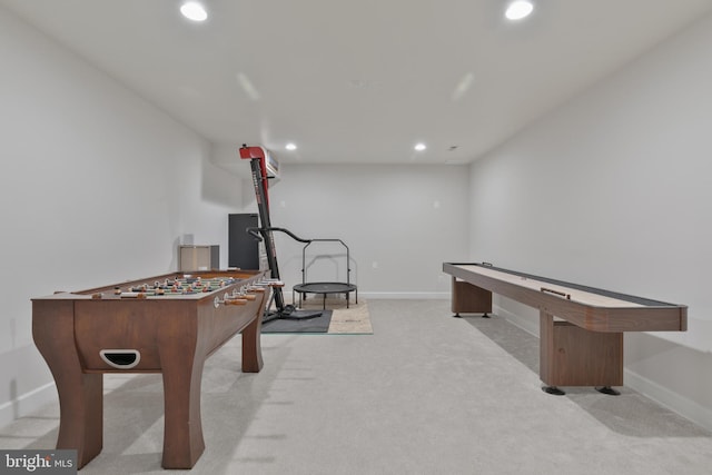 recreation room with light colored carpet, baseboards, and recessed lighting