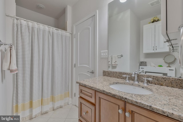 full bath featuring tile patterned flooring, vanity, visible vents, and curtained shower