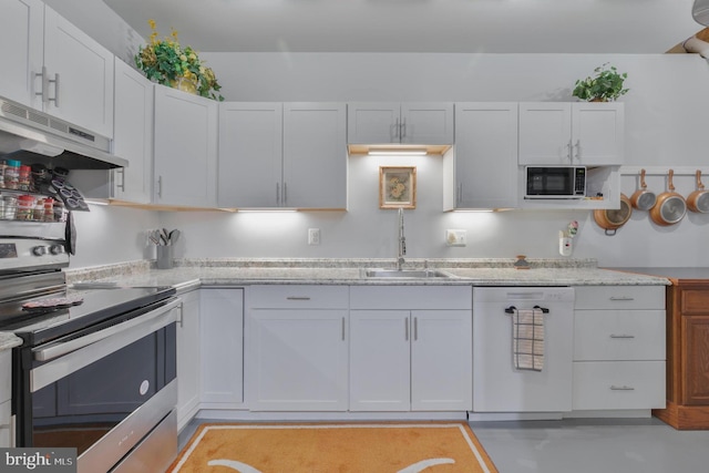 kitchen featuring stainless steel electric range oven, dishwasher, a sink, under cabinet range hood, and white cabinetry