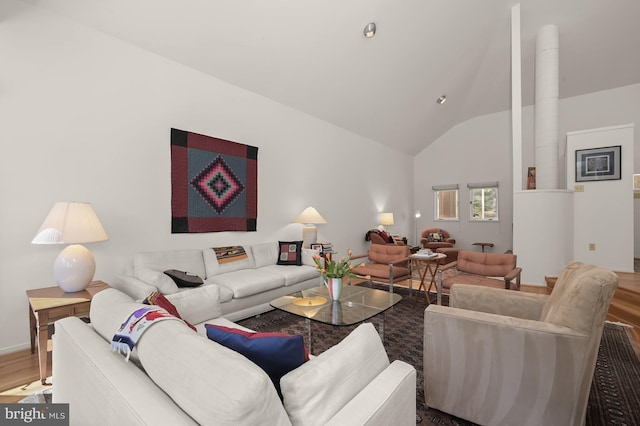 living room featuring lofted ceiling and wood finished floors