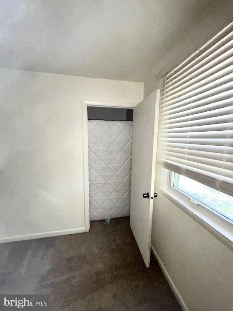 136 Charles Pl, Indian Head, MD 20640 - unfurnished room with baseboards and dark colored carpet