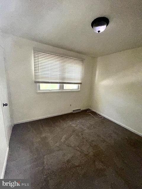 136 Charles Pl, Indian Head, MD 20640 - unfurnished room with visible vents, dark carpet, and baseboards