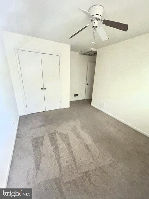 136 Charles Pl, Indian Head, MD 20640 - unfurnished bedroom with baseboards, a ceiling fan, carpet floors, and a closet