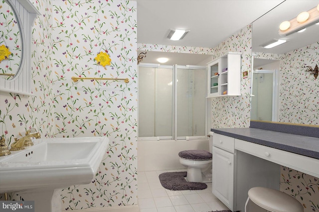 12201 Wight St Unit 301, Ocean City, MD 21842 - bathroom with tile patterned floors, wallpapered walls, bath / shower combo with glass door, and toilet