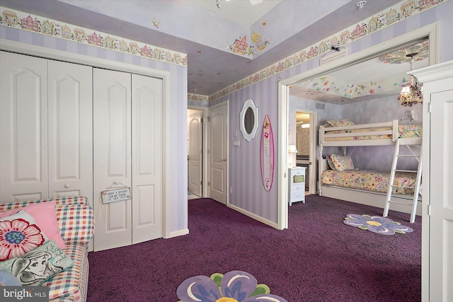 12201 Wight St Unit 301, Ocean City, MD 21842 - bedroom with a closet, wallpapered walls, dark colored carpet, and baseboards