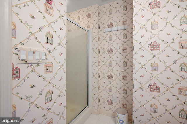 12201 Wight St Unit 301, Ocean City, MD 21842 - bathroom featuring a stall shower, tile patterned flooring, and baseboards