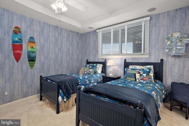 12201 Wight St Unit 301, Ocean City, MD 21842 - bedroom with wooden walls, a textured ceiling, carpet floors, and baseboards