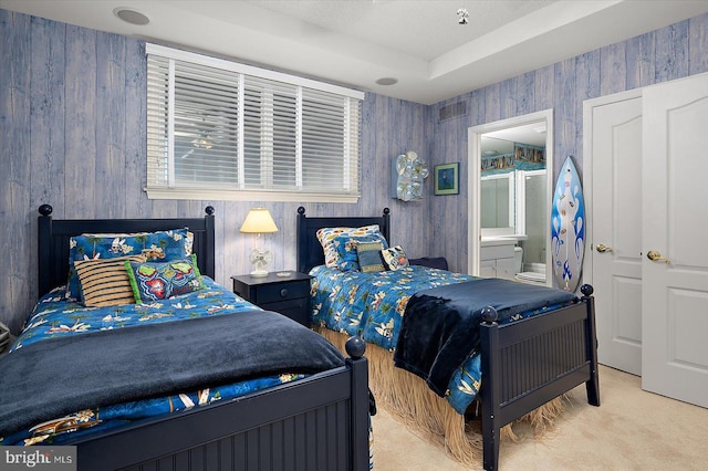 12201 Wight St Unit 301, Ocean City, MD 21842 - carpeted bedroom with wood walls and ensuite bath