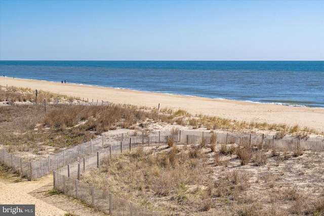12201 Wight St Unit 301, Ocean City, MD 21842 - property view of water featuring a beach view and fence