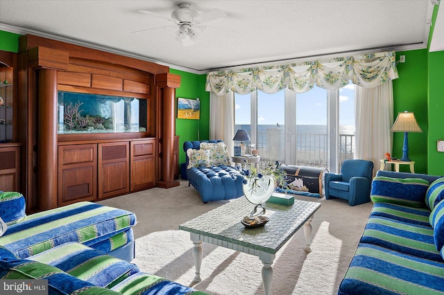 12201 Wight St Unit 301, Ocean City, MD 21842 - living room with ornamental molding, ceiling fan, and light colored carpet
