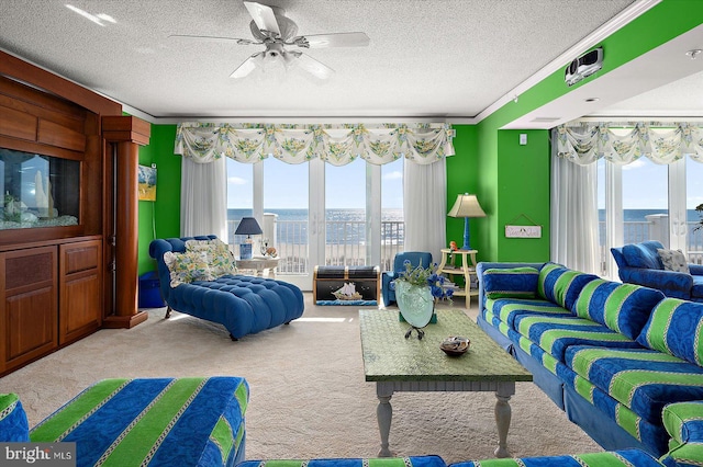 12201 Wight St Unit 301, Ocean City, MD 21842 - living room featuring carpet, plenty of natural light, a water view, and a textured ceiling