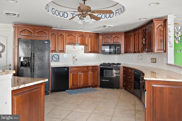 12201 Wight St Unit 301, Ocean City, MD 21842 - kitchen with black appliances, visible vents, ceiling fan, and light stone counters