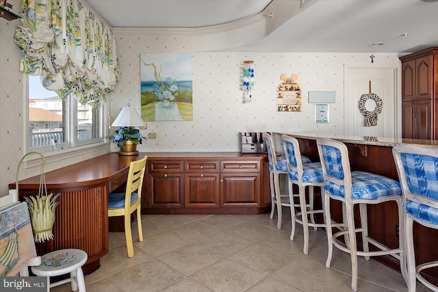 12201 Wight St Unit 301, Ocean City, MD 21842 - kitchen featuring light tile patterned floors, crown molding, and wallpapered walls