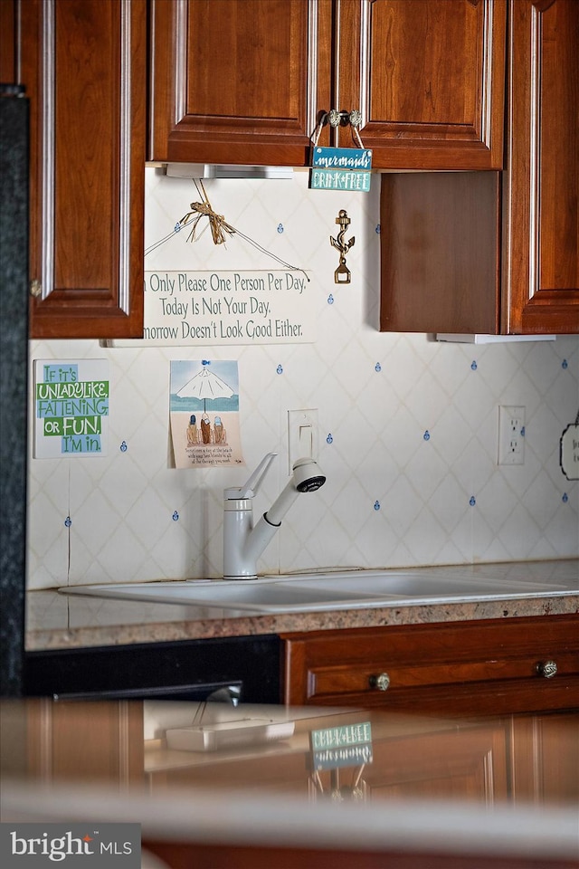 12201 Wight St Unit 301, Ocean City, MD 21842 - kitchen with a sink and decorative backsplash
