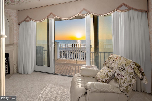 12201 Wight St Unit 301, Ocean City, MD 21842 - living room with a fireplace, carpet floors, and a water view