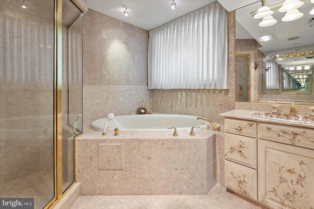 12201 Wight St Unit 301, Ocean City, MD 21842 - full bath featuring a shower stall, wallpapered walls, a bath, tile patterned floors, and vanity