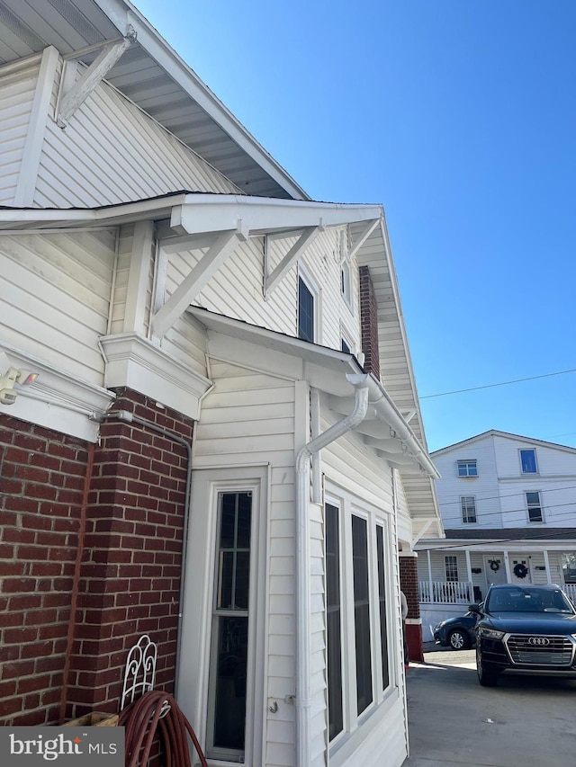 view of home's exterior featuring brick siding
