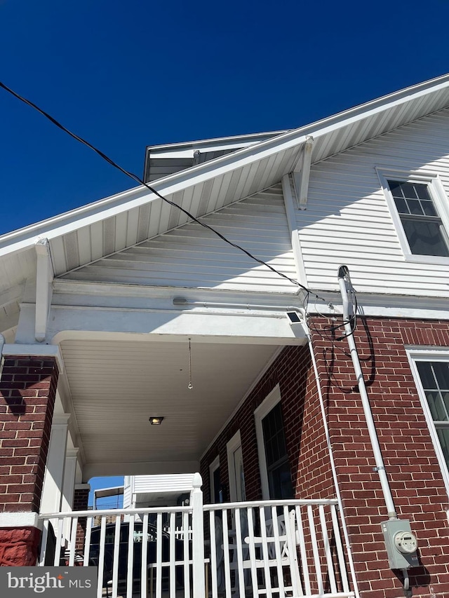 view of side of property with brick siding