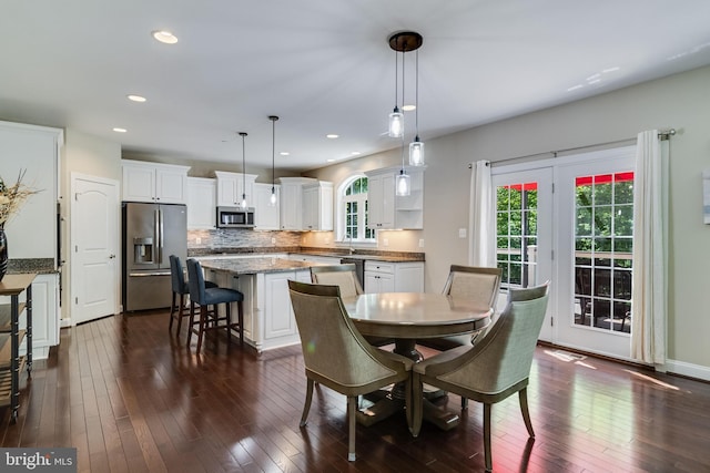 dining space with visible vents, recessed lighting, and dark wood finished floors