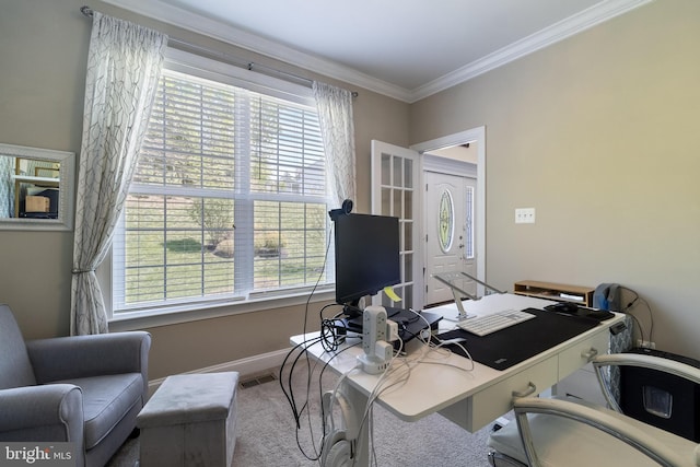 office space with baseboards, ornamental molding, and a healthy amount of sunlight