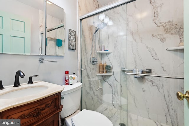5211 Al Jones Dr, Shady Side, MD 20764 - bathroom with toilet, vanity, and a marble finish shower