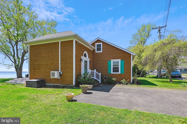 5211 Al Jones Dr, Shady Side, MD 20764 - view of front facade featuring a front yard and ac unit