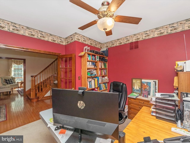 rec room featuring a ceiling fan, wood finished floors, and visible vents