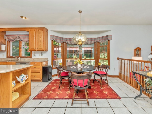 dining room featuring baseboards, a chandelier, and light tile patterned floors