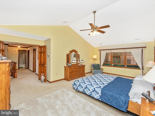 bedroom featuring light colored carpet, vaulted ceiling, baseboards, and a ceiling fan
