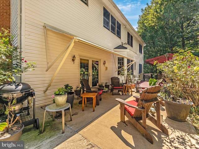 view of patio featuring french doors and grilling area