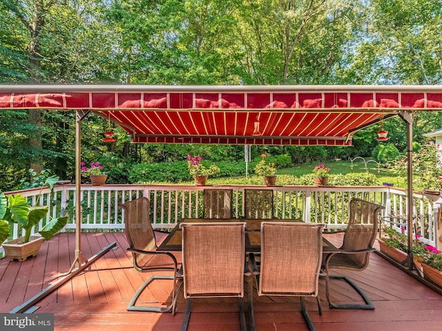 wooden deck with outdoor dining space