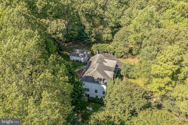 drone / aerial view featuring a forest view