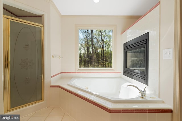 full bath with a stall shower, a garden tub, ornamental molding, and tile patterned flooring