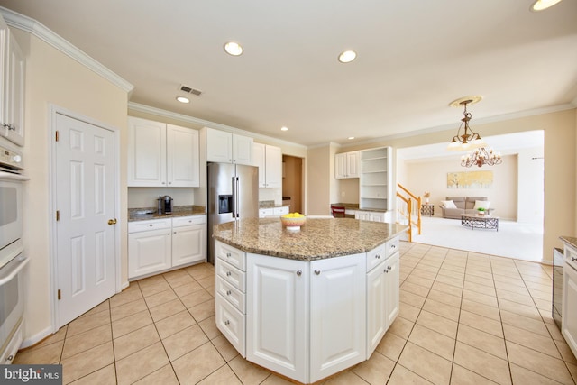kitchen with light tile patterned floors, crown molding, a kitchen island, white cabinets, and stainless steel fridge with ice dispenser