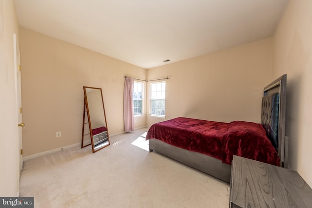 bedroom with carpet flooring and baseboards